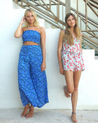 Bed to Beach shorts floral print orange on aqua blue designer Lotty B Mustique luxury vacation fashion