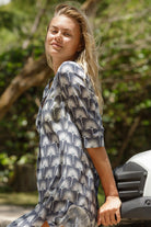 Tropical vacation dress in pure silk with black and white repeated single Palm print by designer Lotty B Mustique