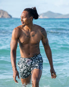 Luxury men’s Iguana Spruce swim shorts by Pink House Mustique, made from 100% recycled quick-dry shell fabric.