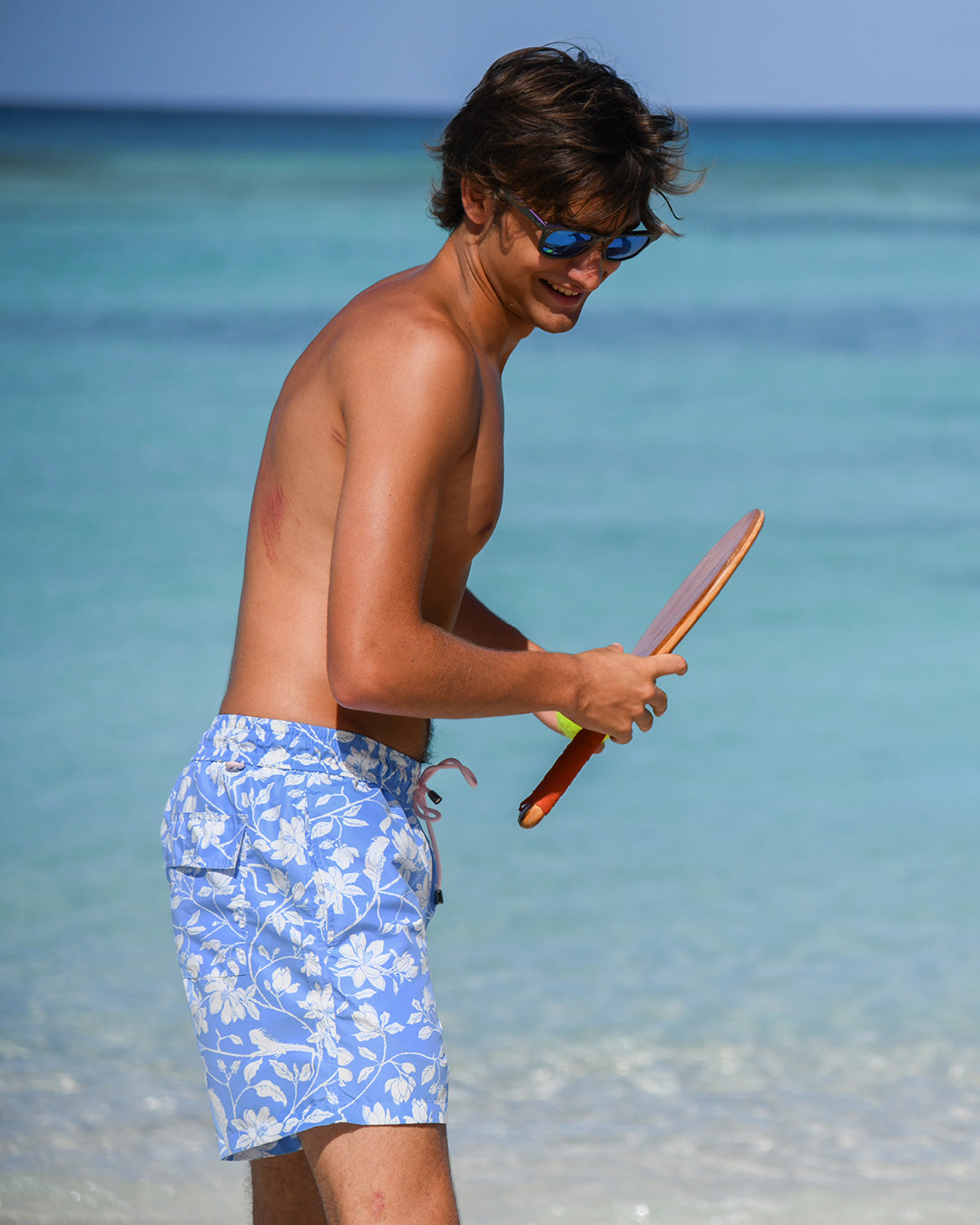 Luxury men’s Iguana Blue swim shorts crafted from recycled shell fabric, lightweight and comfortable for resort wear.