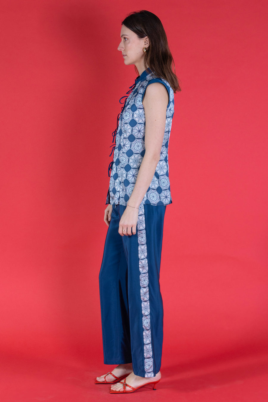Marina trousers in blue silk crepe de Chine with an April Showers print stripe worn together with matching Marina waistcoat top from Pink House Atelier Collections - handmade made to order