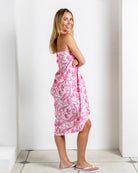 Side view of Parrot Pink silk sarong worn strapless – chic tropical resortwear by Lotty B