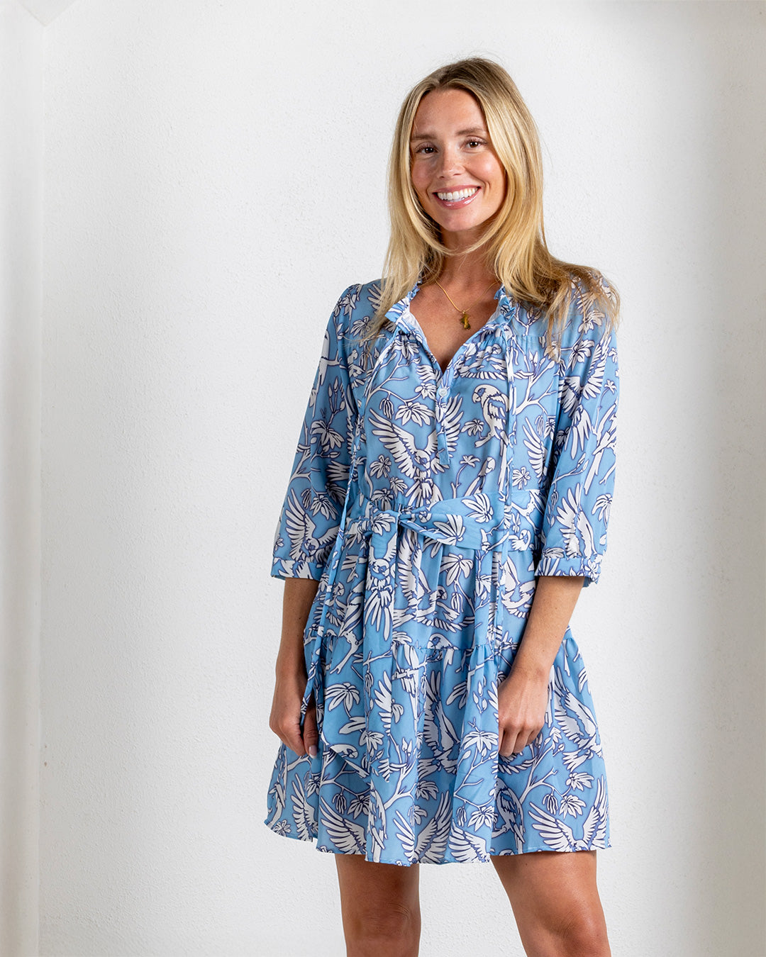 Close-up of silk crepe Amy dress in Parrot blue print – elegant tropical resortwear with soft gathers