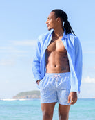 Men’s linen shirt and swim shorts in Coral Stone Blue print by Pink House Mustique, luxury beachwear.