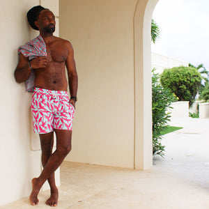 Caribbean vacation men's swim shorts in turquoise blue and coral red Parrot print by designer Lotty B