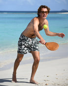 Luxury men’s Iguana Spruce swim trunks by Pink House Mustique, lightweight sustainable fabric and European cut.