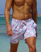 Close-up of Pink House Mustique Mermaid Pink Blue swim shorts inspired by Oliver Messel and worn at Lagoon Bay Mustique