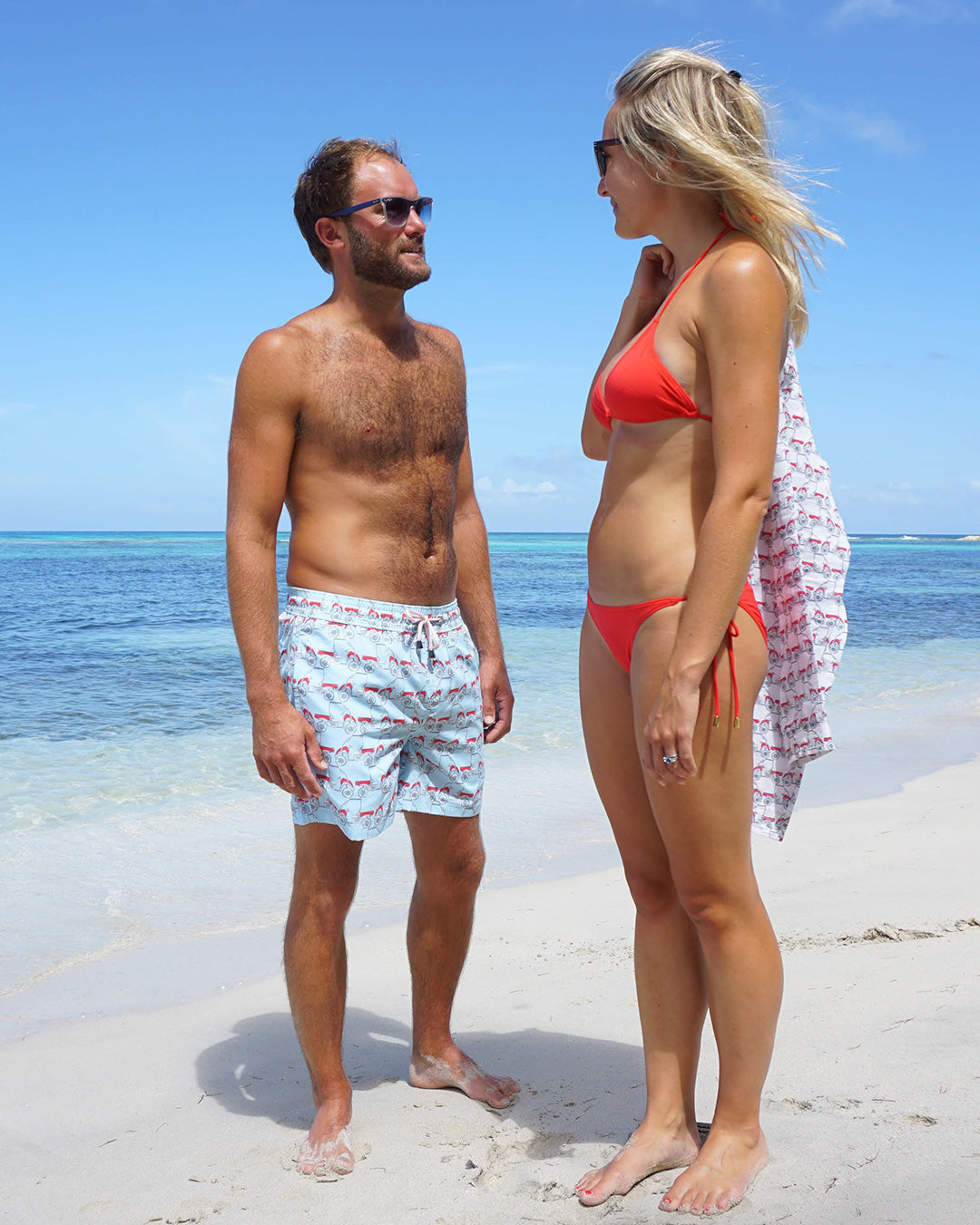 Men’s Mustique Mule red swim shorts on the beach in Mustique