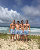 Mens palm stripe swim shorts blue group on beach Mustique quick dry summer swimwear