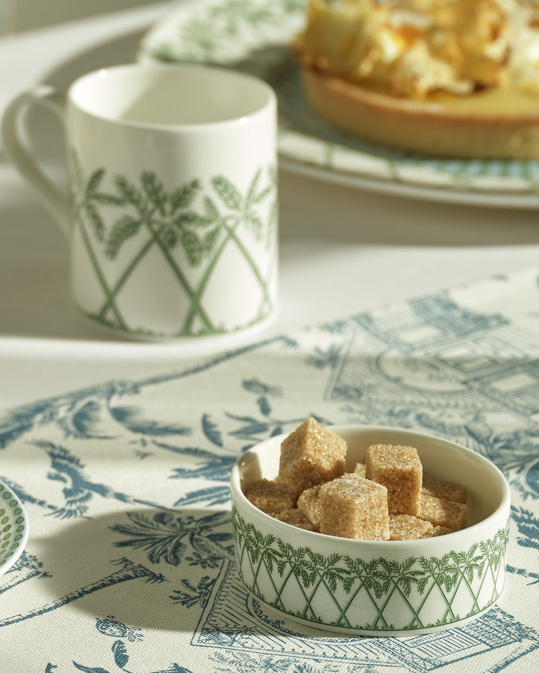 Elegant fine bone china small dish in Palms Sage Green used as sugar bowl, part of the Pink House Mustique coffee set.