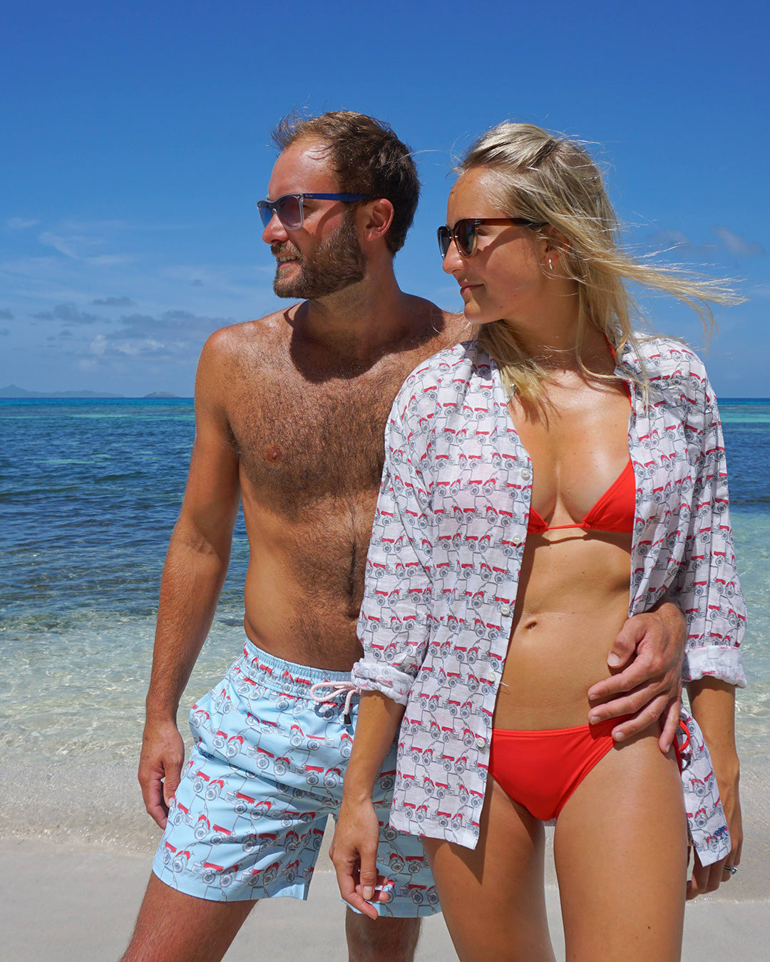 Mustique Mule red men’s swim shorts worn on the beach in Mustique