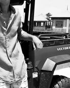 Mustique Mule red swim shorts beside a Mustique beach buggy at Basil’s Bar