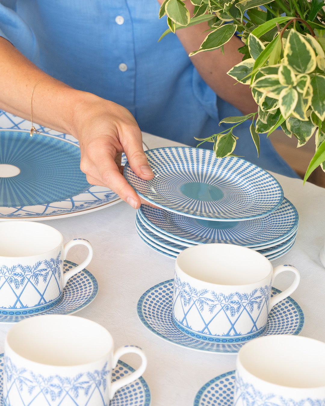 Tea set featuring fine bone china Palms Azure Blue cups and saucers and side plates styled for relaxed island dining.