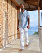Men's Parrot Blue silk Festival Shirt styled with white linen trousers at Frenchman's Field Villa