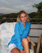 Model wearing Pink House women’s turquoise pure linen Kim shirt blouse, styled for island living on Mustique