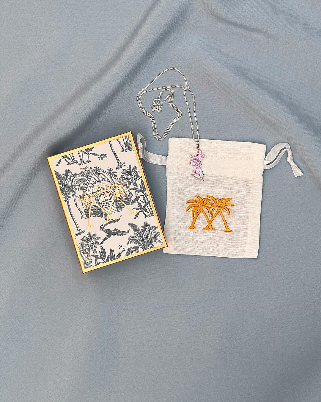 Sterling silver Mustique island pendant necklace with pink zirconia crystals Pink House Mustique gift box