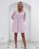 Model wearing short tiered linen Amy dress in Agave Pink by Lotty B for Pink House Mustique, island resortwear fashion