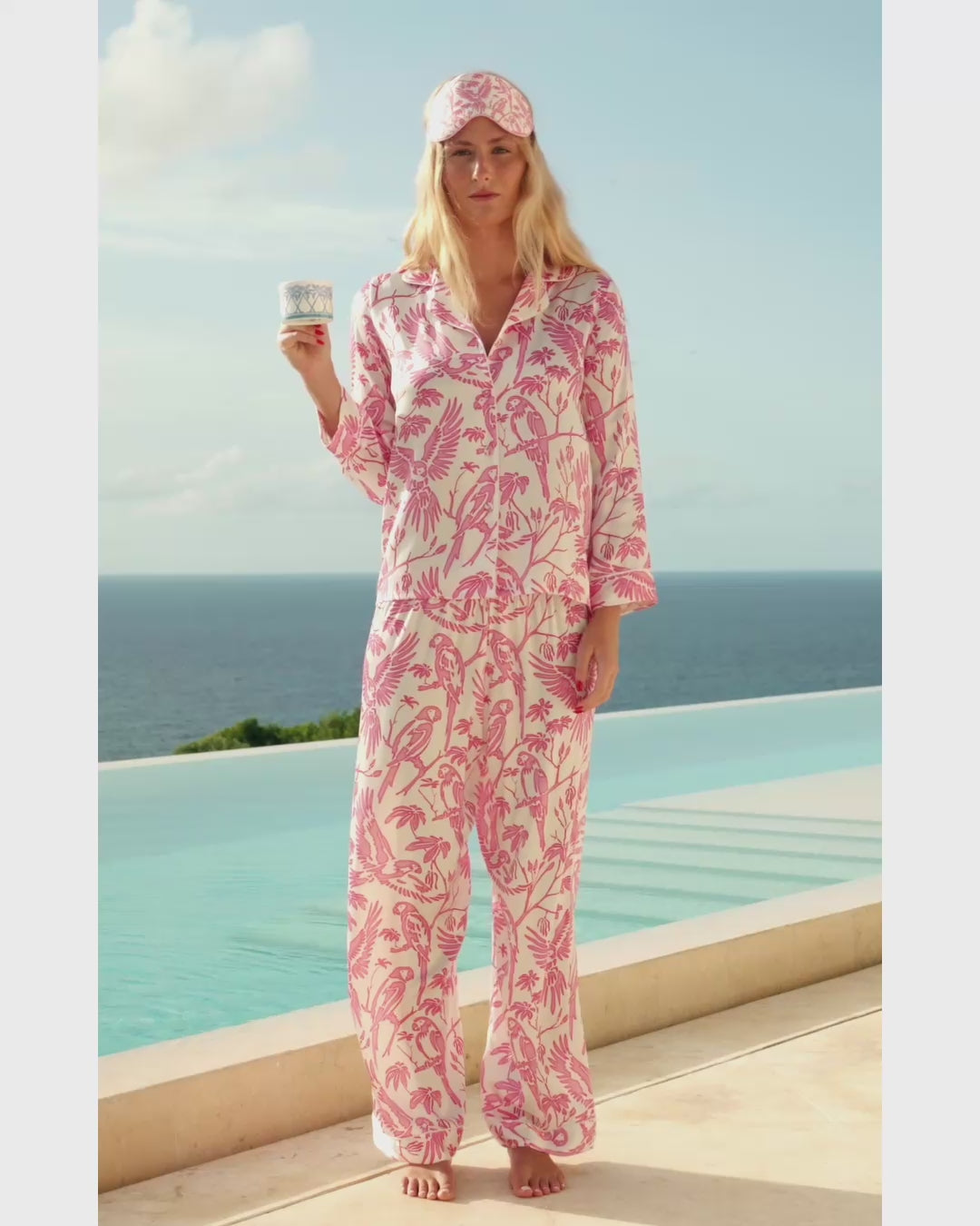 Constance modeling Parrot silk Atelier collection by the villa pool on Mustique island, luxury resortwear campaign video