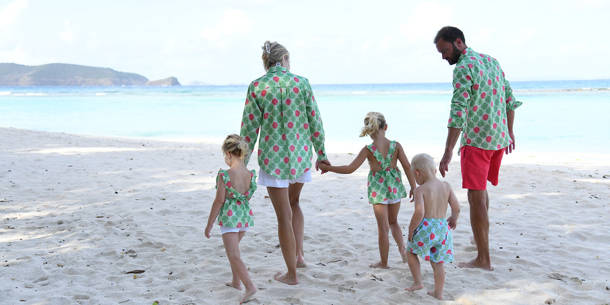 Family wearing Watermelon print linen and swimwear on the beach in Mustique