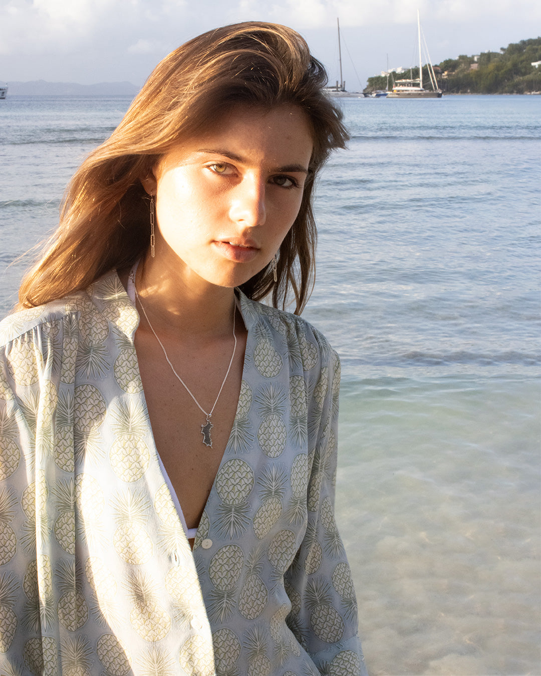 Pink House silk Decima Dress in Pineapple Olive with Mustique Island silver pendant – ocean-inspired luxury fashion with exclusive tropical print.
