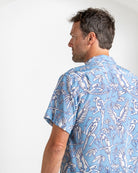 Back view of blue silk parrot print shirt for men – breathable summer fashion from Pink House Mustique