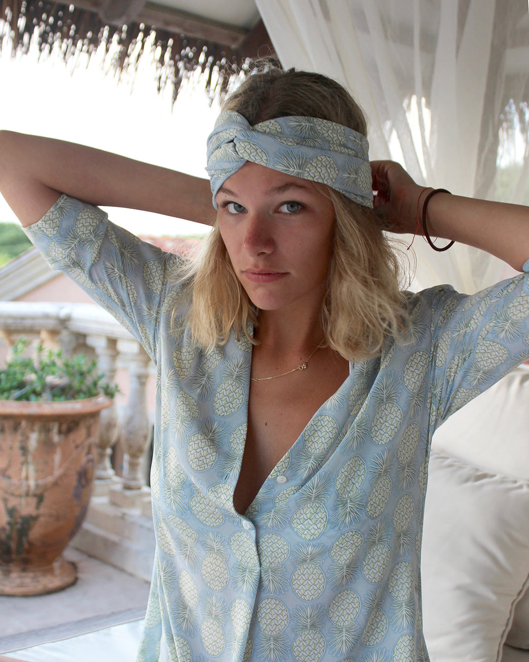 Matching silk headscarf and Pink House Decima Dress in Pineapple Olive – tropical printed silk outfit for chic resort wear and laid-back elegance.
