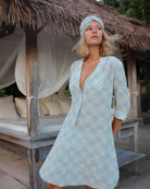Full-length view of Pink House silk Decima Dress in Pineapple Olive – soft flared silhouette with pineapple pattern, ideal for beach weddings and summer evenings.