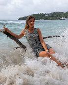Pink House Mustique Silk Henny Dress in Whale print on the beach in Mustique