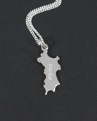 Mini Mustique Island charm pendant in sterling silver, British hallmarked jewellery