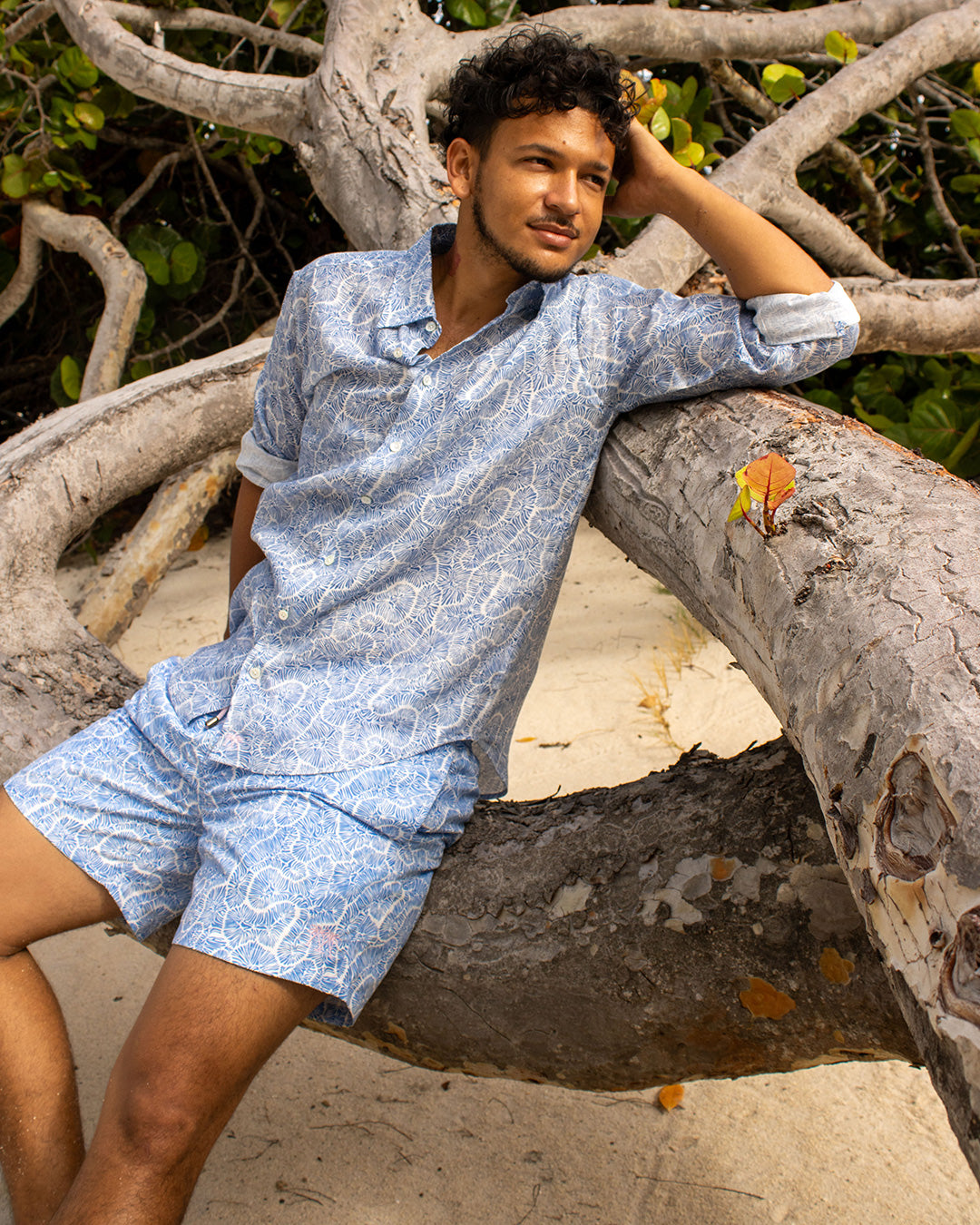 Stylish men’s linen shirt with matching Coral Stone Blue swim shorts by Pink House Mustique, island luxury.