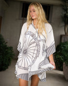 Chic cover up style for a villa holiday with a silk kaftan in bicycle print by designer Lotty B Mustique