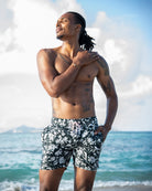 Men’s Iguana Spruce printed swim trunks, lightweight and breathable with soft mesh lining and drawstring waist.