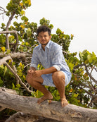 Men’s Coral Stone Blue linen shirt and swim shorts set by Pink House Mustique, relaxed vacation look.