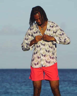 Holiday style mens linen shirt in Monkey & Palm plum navy & green print by designer Lotty B