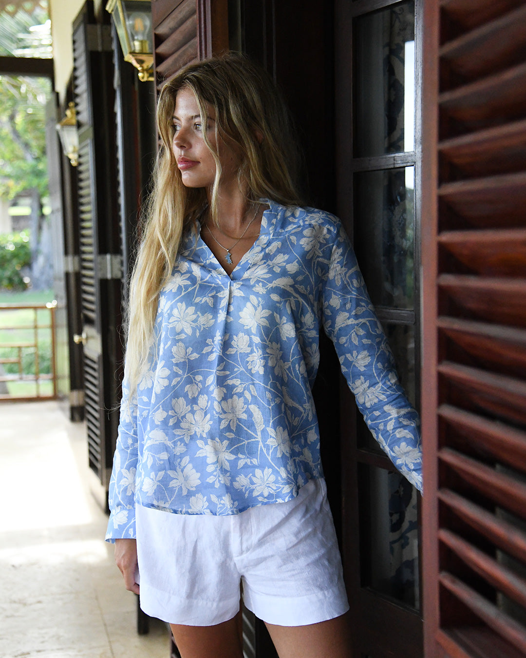 Women’s blue Iguana print linen Kim blouse by Pink House Mustique, relaxed island style at Sleeping Dragon villa.