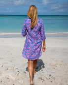 Women’s Iguana Blue and Pink Decima linen dress by Pink House Mustique, beach style on Lagoon Beach Mustique.
