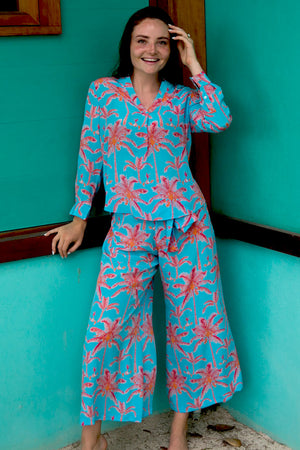Chic vacation style, palazzo pants in tropical turquoise & orange plantation palm print with matching silk Kim blouse