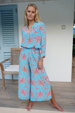 Designer holiday outfit, palazzo pants in tropical turquoise & orange plantation palm print with matching silk Kim blouse
