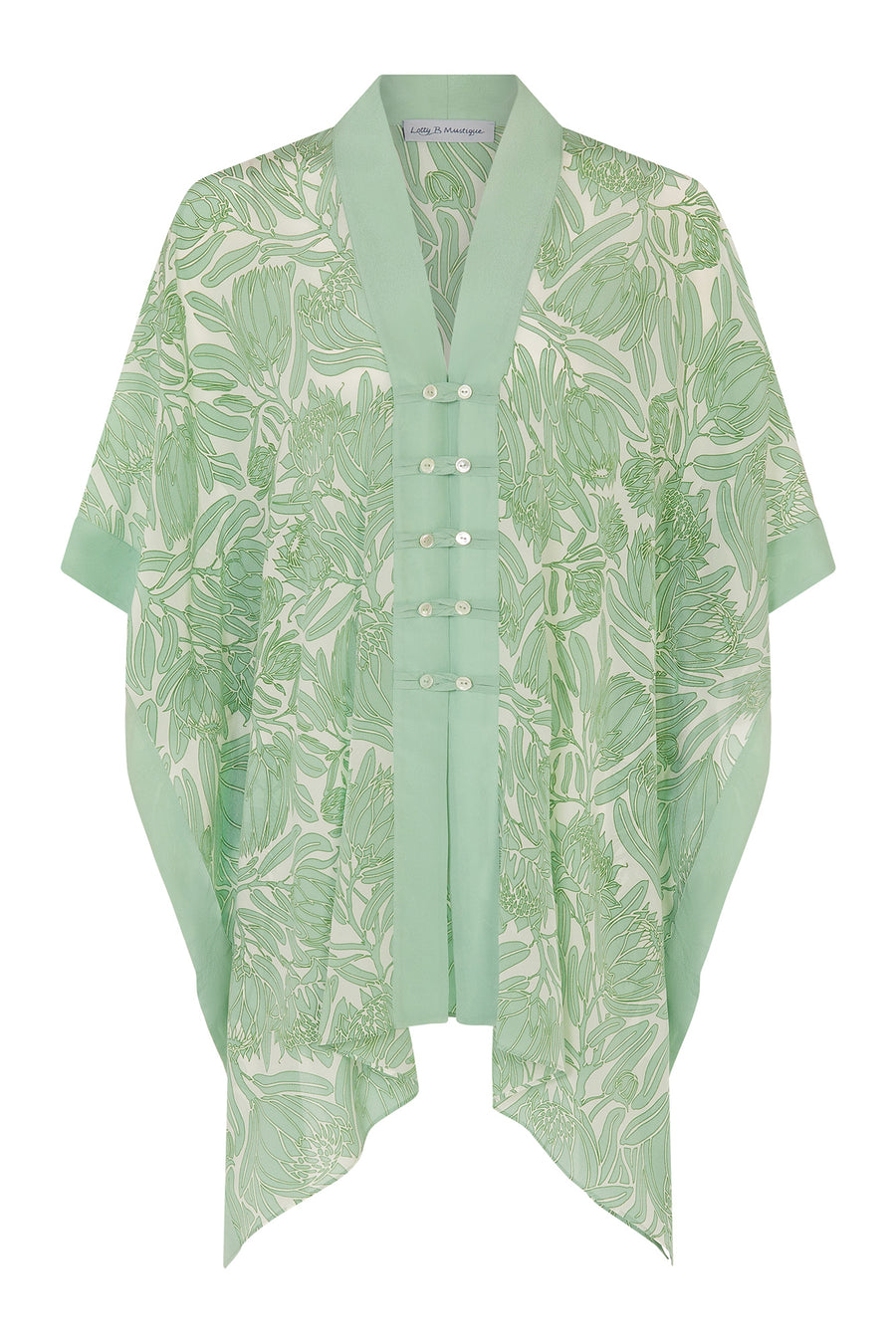 Chic vacation style buttoned poncho in floral green Protea print by Lotty B Mustique