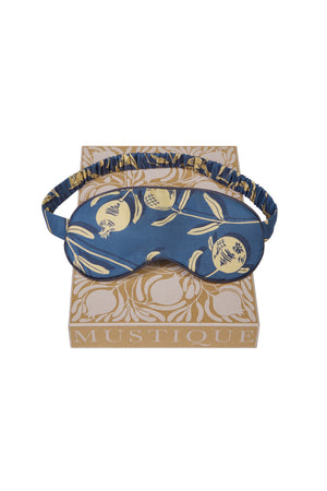 Luxury silk eye mask in gold and navy Pomegranate print. Limited edition sleepwear accessories by Lotty B Mustique. Handmade in England