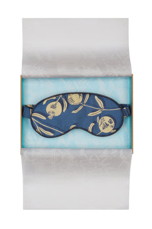 Limited edition pure silk eye mask in gold and navy Pomegranate print by Lotty B Mustique. Handmade in England