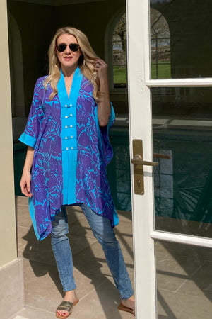 Chic summer silk cape style cover up in violet & turquoise floral protea print