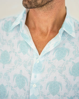 Men's linen shirt detail and quality in aqua blue Turtle print by designer Lotty B Mustique
