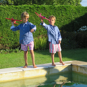 Childrens pure linen navy blue shirt & red blue guava print swim shorts  by Pink House Mustique, holiday villa lifestyle