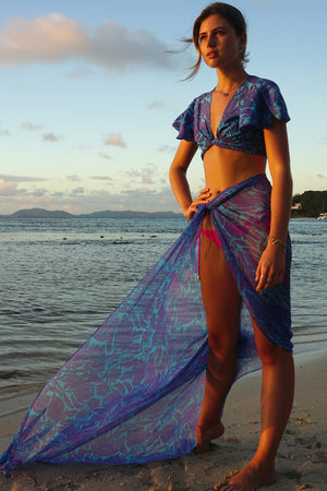 Floaty beachwear in luxury silk chiffon, purple & blue Protea print by designer Lotty B Mustique