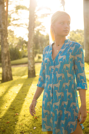 Tropical holiday style short flared dress in pure silk Lurcher green blue print designer Lotty B Mustique