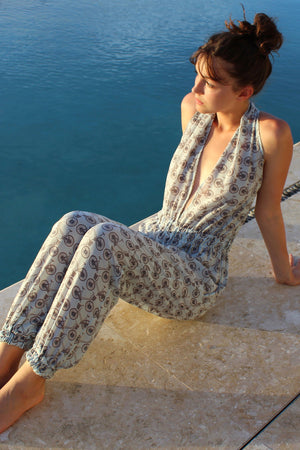 Lotty B Jumpsuit in Silk Crepe-de-Chine: BICYCLE - BLACK/PALE BLUE sitting by the pool Mustique