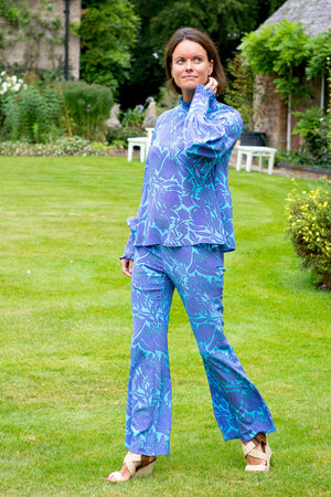 Fit & flare silk trousers & matching Kelly blouse in Protea violet & turquoise print by designer Lotty B
