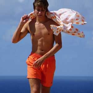 Mens quick dry orange swim shorts by designer Lotty B Mustique for Pink House holiday essentials