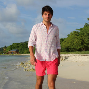 Mens quick-dry swim shorts in faded red designer Lotty B Mustique for Pink House holiday essentials
